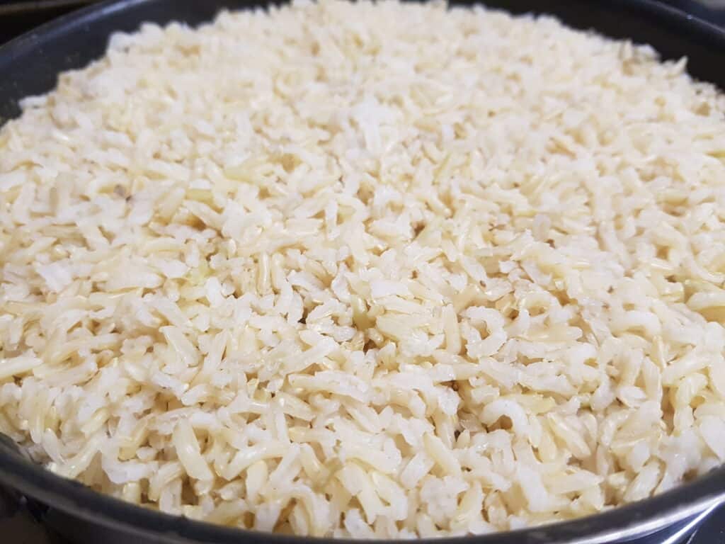 A close-up image of steam-cooked brown basmati rice