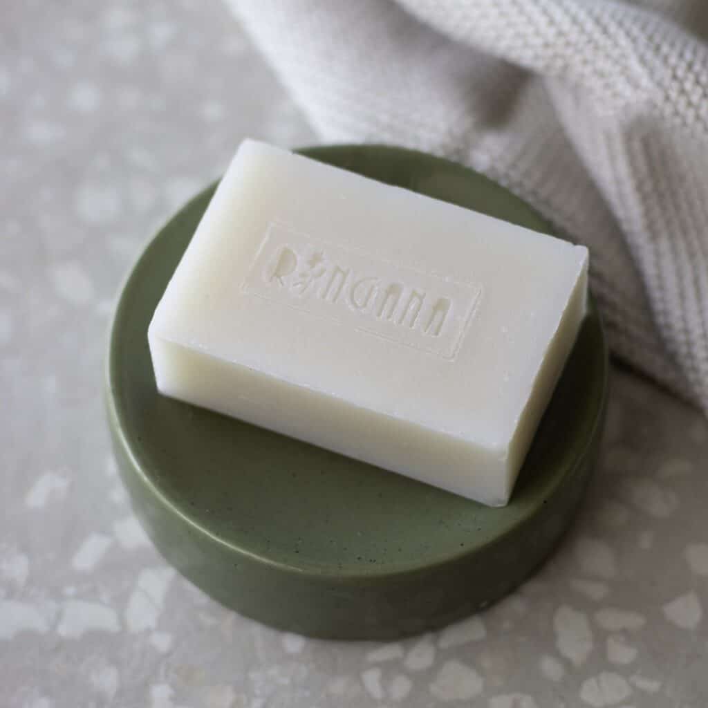 Ringana fresh vegan skincare bar of soap on a soap dish.