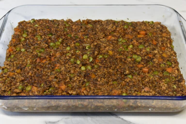 vegan shepherd's pie filling in a rectangular glass oven dish