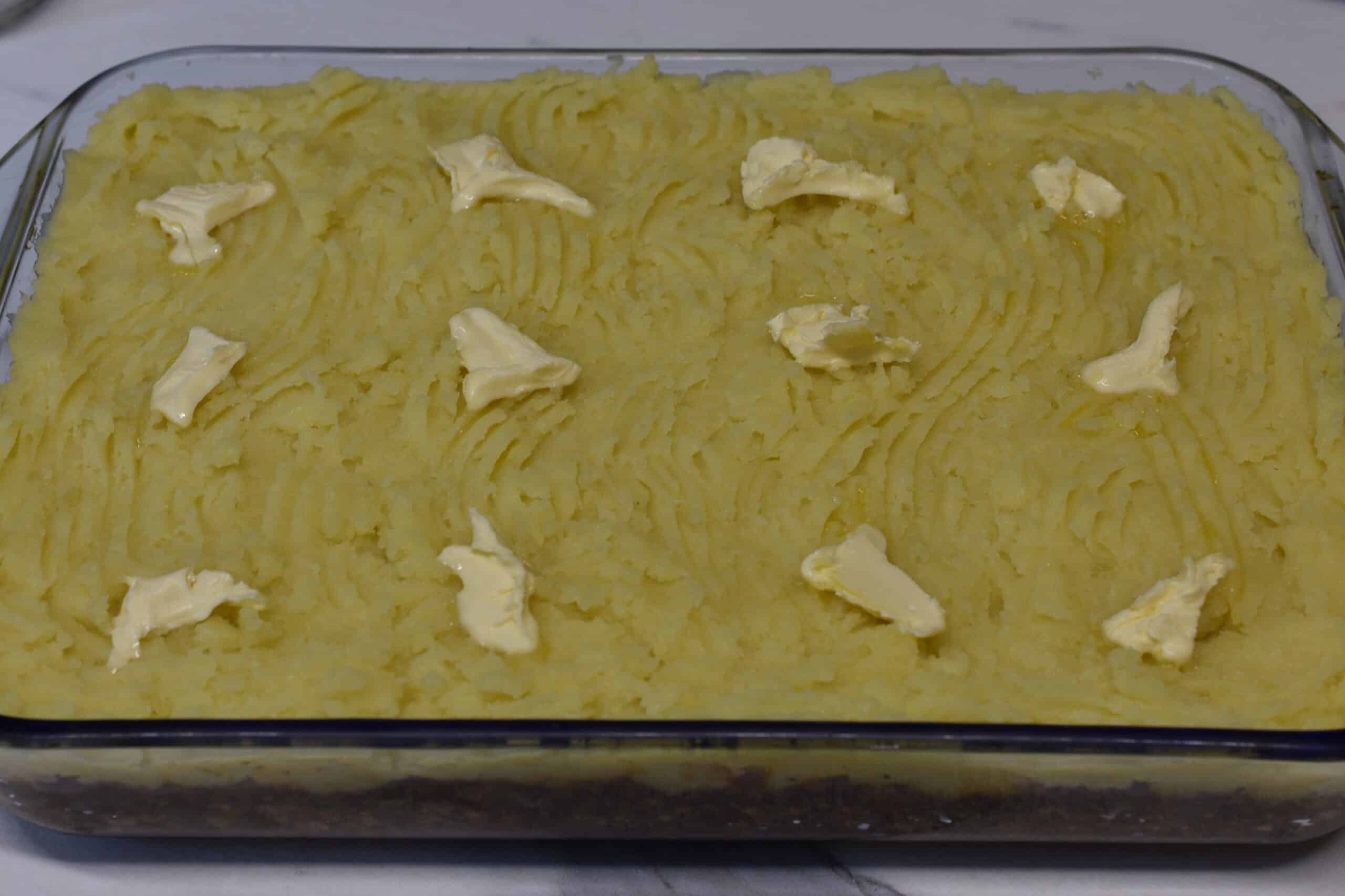 Vegan shepherd's pie with knobs of vegan butter