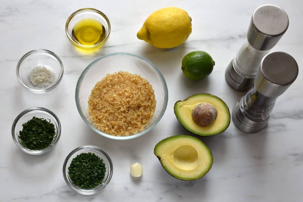 Ingredients for avocado lime rice in individual glass bowls.