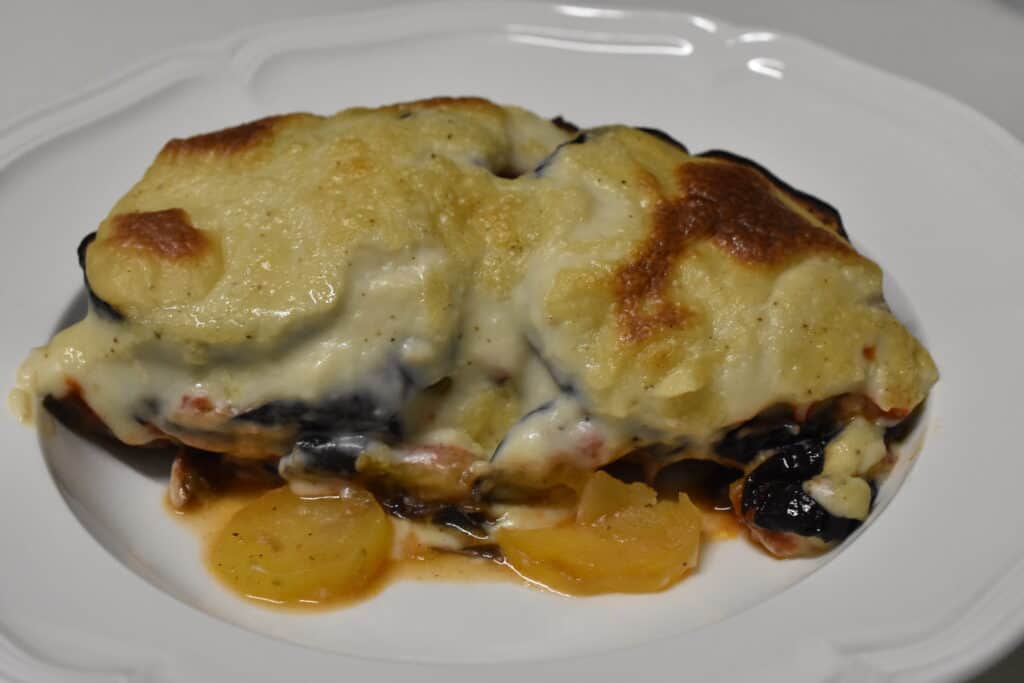 A portion of aubergine moussaka on a plate