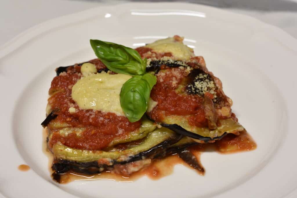 A portion of aubergine parmigiana on a plate