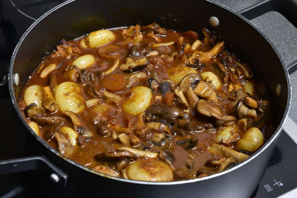 Mushroom bourguignon in a pan on the stove