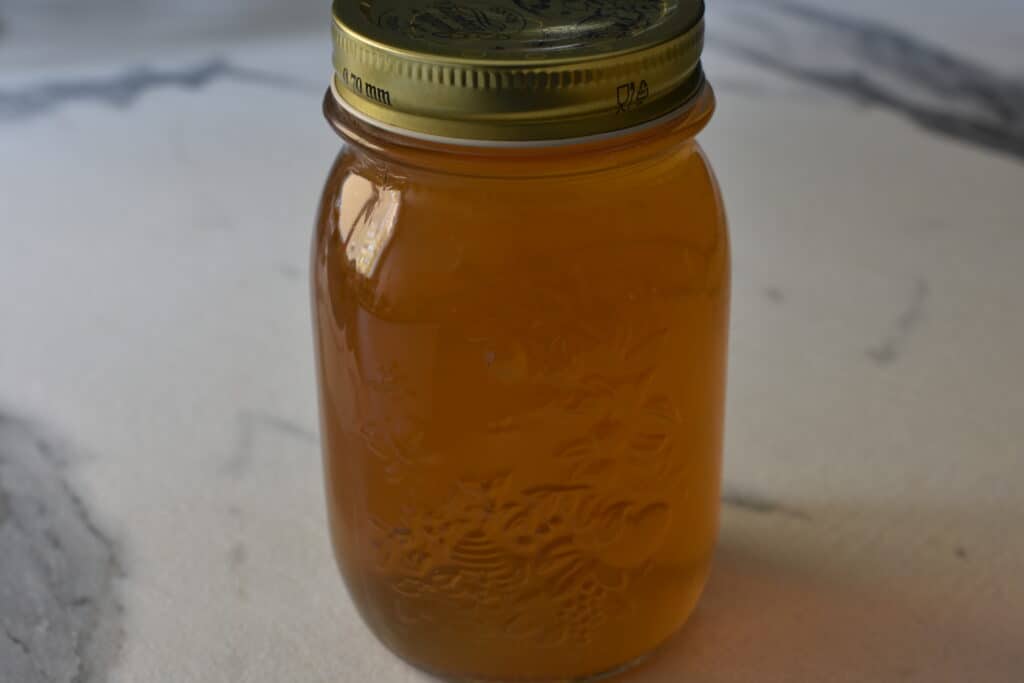 A jar of vegetable broth on a kitchen worktop