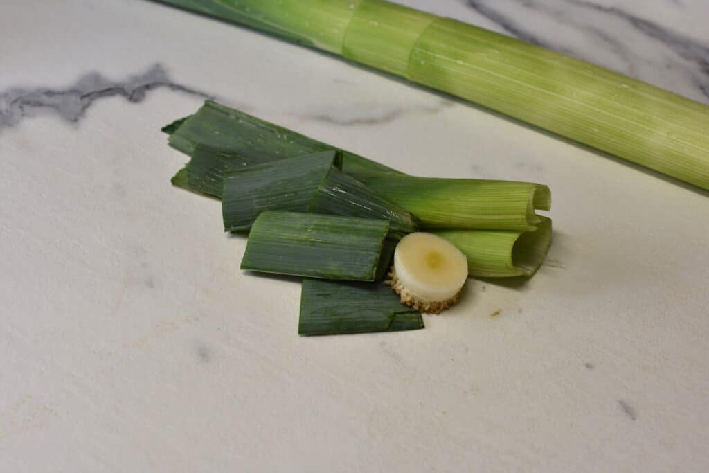 Leek trimmings on a kitchen worktop.