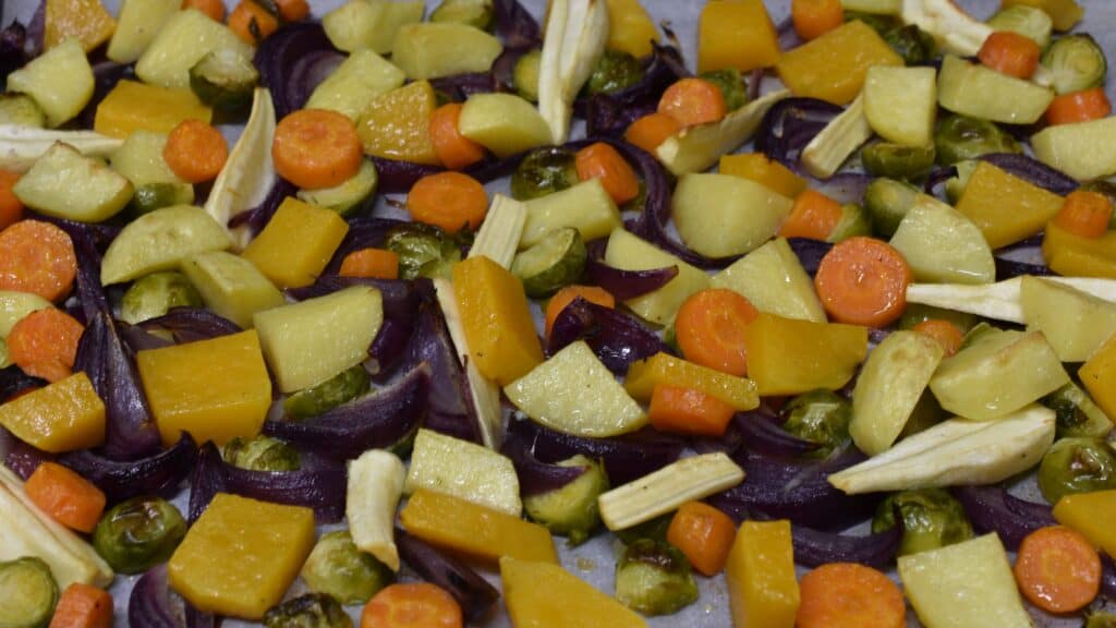 Oven-roasted winter vegetables on an oven tray.