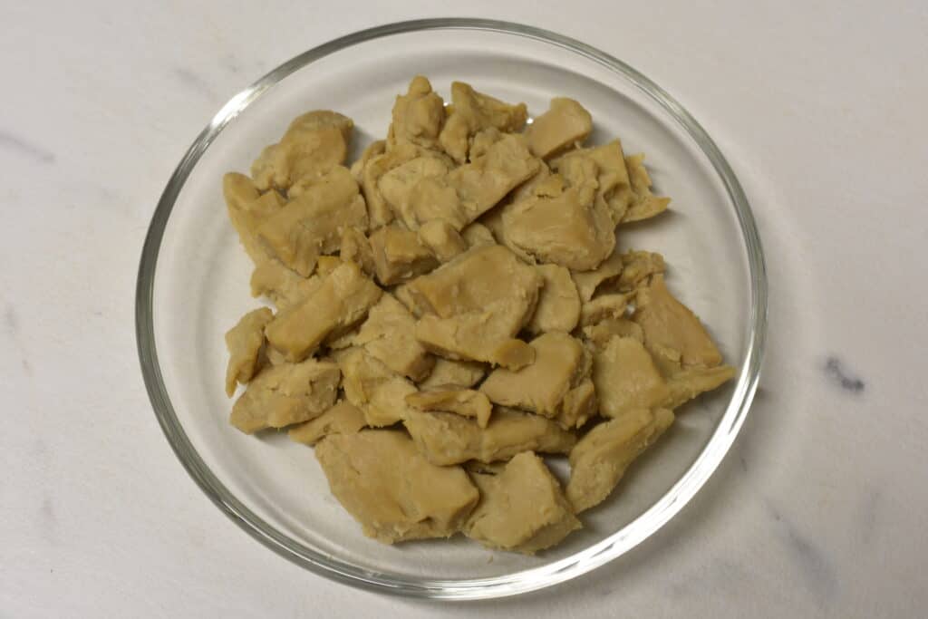 Vegan chicken pieces in a glass bowl.