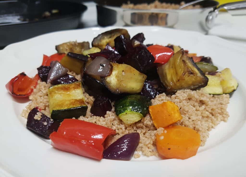 Roasted vegetable couscous on a white plate