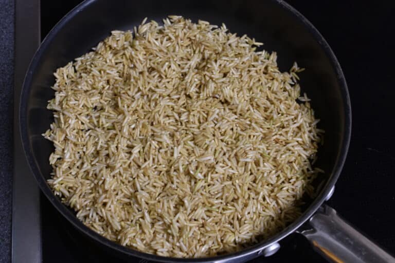 Soaked brown basmati rice in a pan