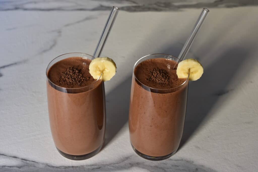 Two glasses of chocolate banana protein shake