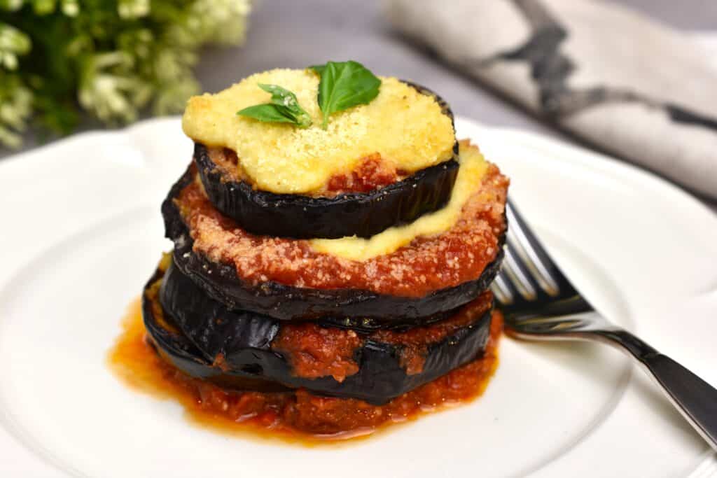 An individual stack of vegan aubergine parmigiana.