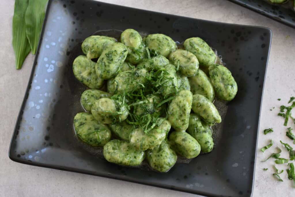 A plate of vegan wild garlic gnocchi.