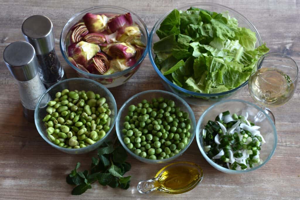 Ingredients for vignarola: artichokes, broad beans, peas, romaine lettuce and spring onions.