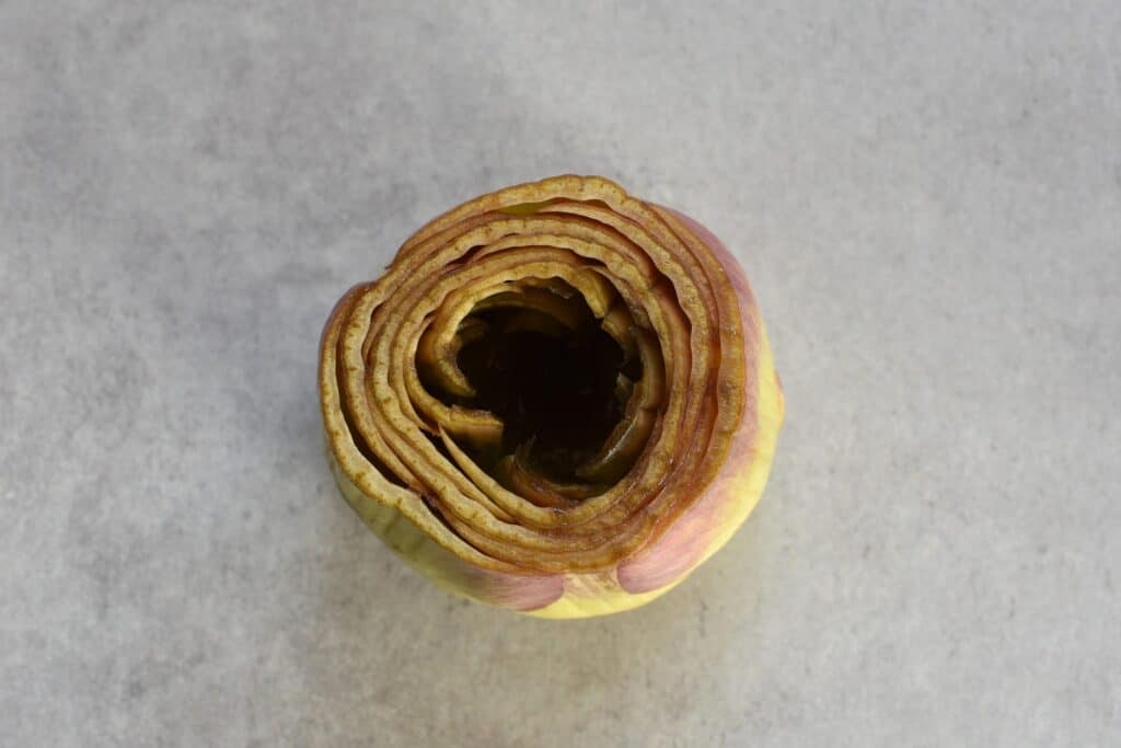 A close-up image of a hollowed out and trimmed artichoke.