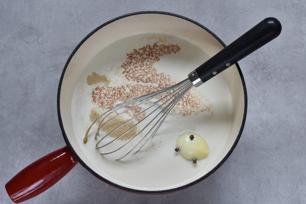 Ingredients for vegan béchamel sauce in a pan.