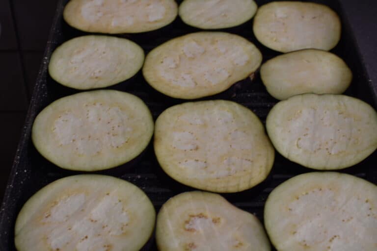 Aubergines slices on a grill pan.