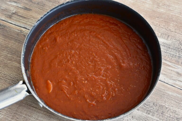 Fresh tomato pasta sauce in a wide pan.