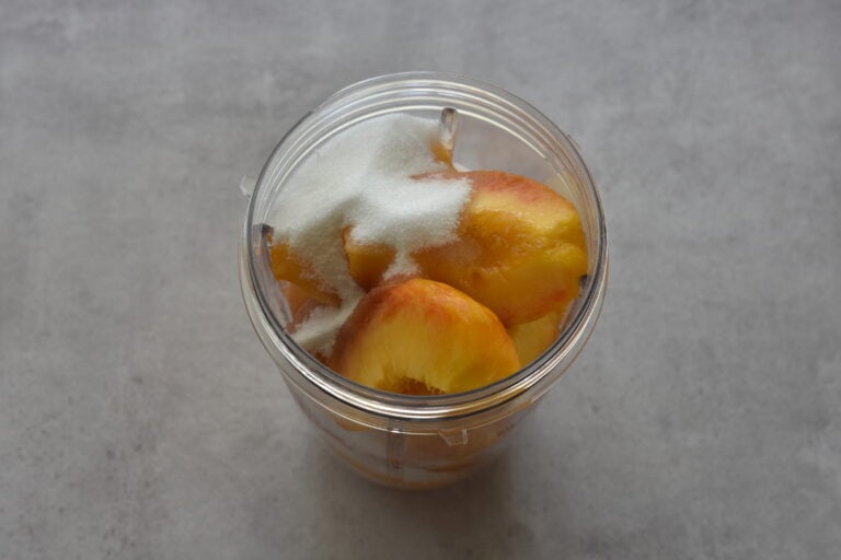 Peach sorbet ingredients in a blender beaker