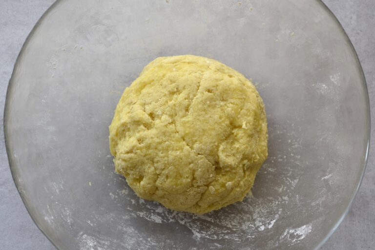 Amalgamate with your hands to form a ball of gnocchi dough.