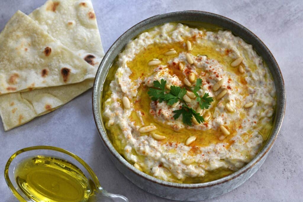 Baba ganoush (moutabal) with slices of pitta bread.