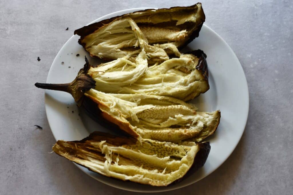 Oven-roasted aubergines cut in half.