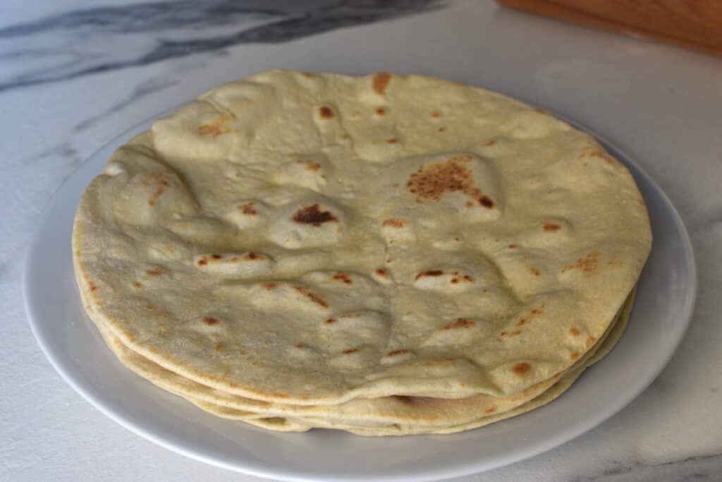 Four piadinas on a plate.