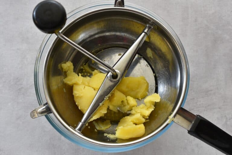 Put the potatoes through a ricer or mouli.