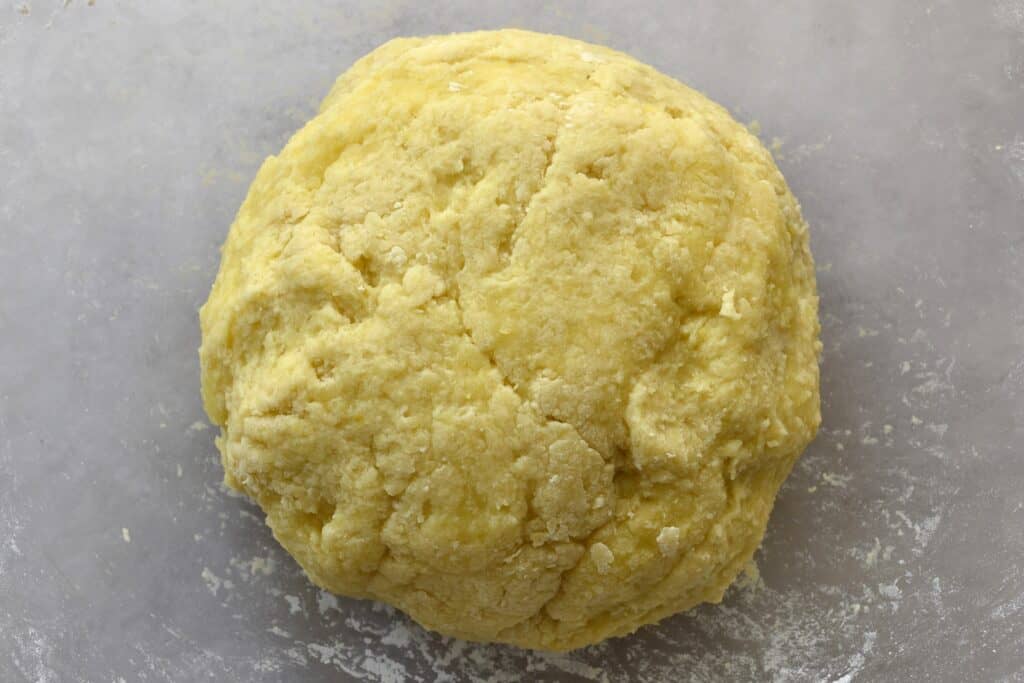 A close-up image of a ball of gnocchi dough.