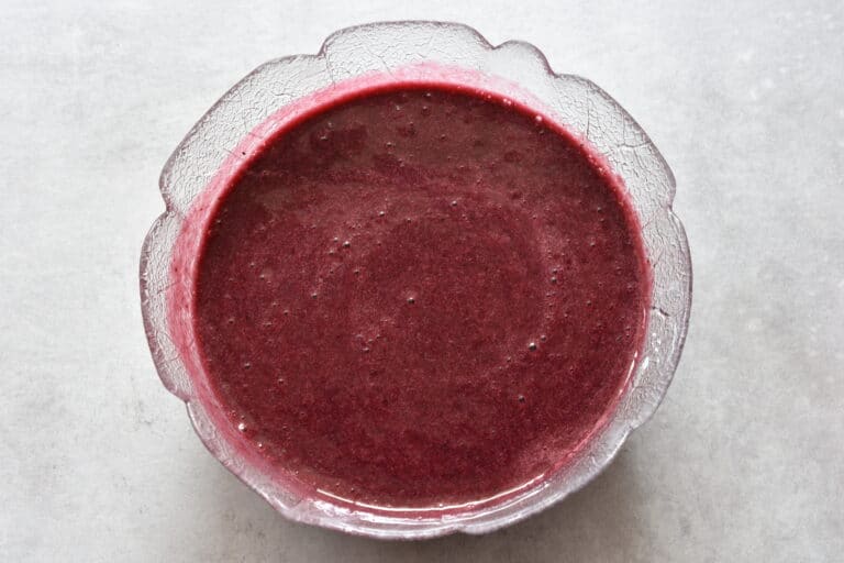 Concord grape mixture in a glass bowl.