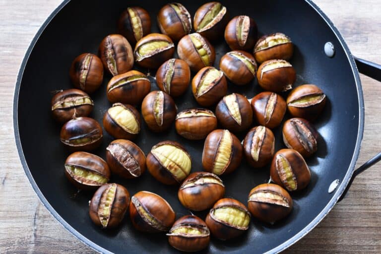 Roasted chestnuts in a pan.