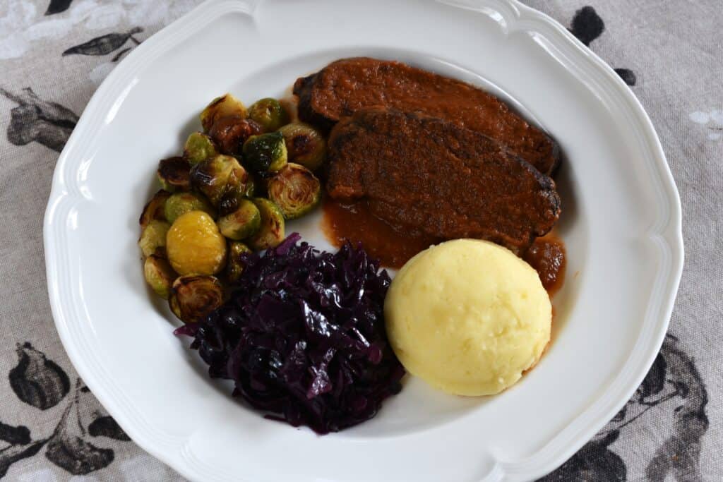 Braised seitan with potato mash, roasted Brussels sprouts with chestnuts and braised red cabbage.