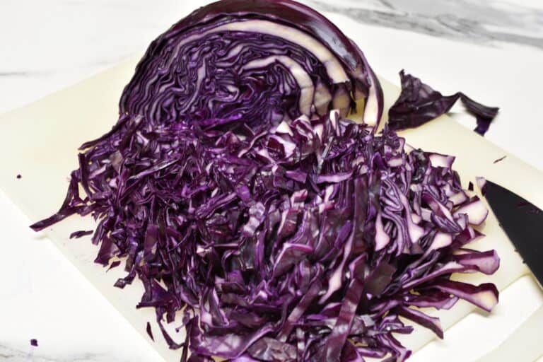 Sliced red cabbage on a chopping board.