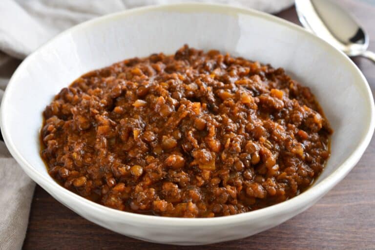 A close-up image of vegan lentil ragu in a bowl.