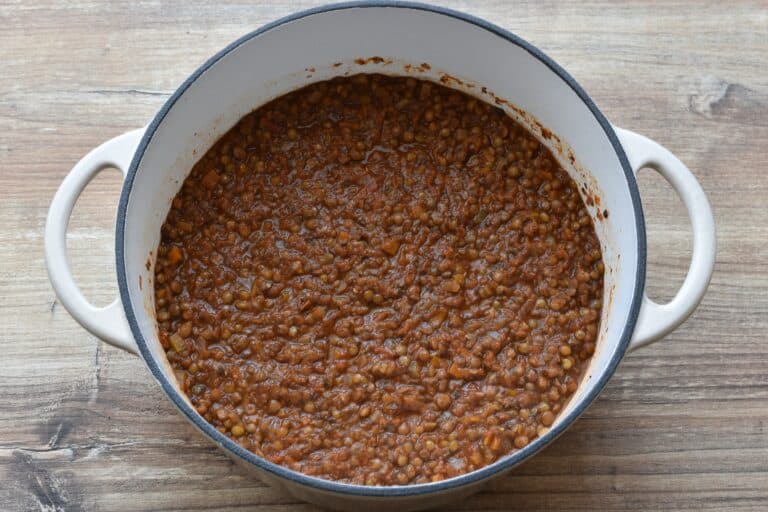 Vegan lentil ragu in a cast iron pan.