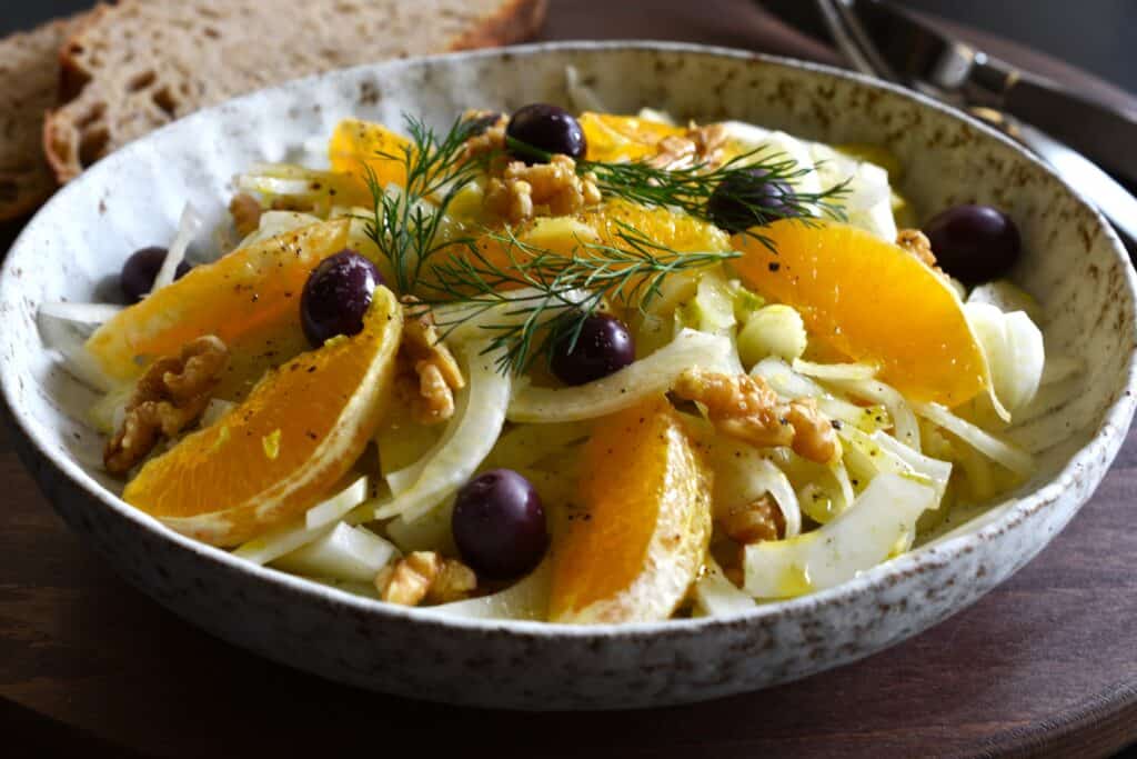 Italian orange and fennel salad with walnuts and black olives (side view).