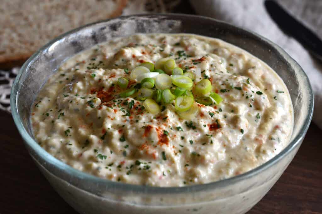 A close-up image of vegan tuna paté in a glass bowl.