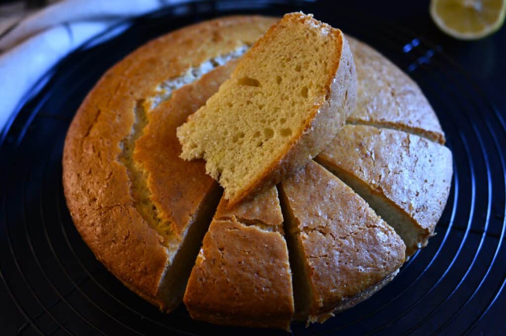 Lemon yoghurt cake on a rack.