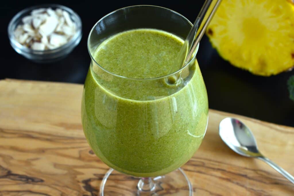 A close-up image of a green pineapple and coconut smoothie.