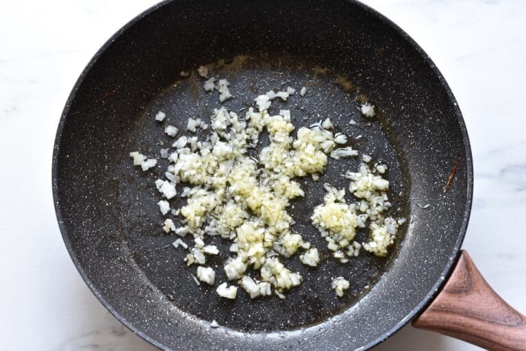 Chopped onion and garlic in a pan with olive oil.