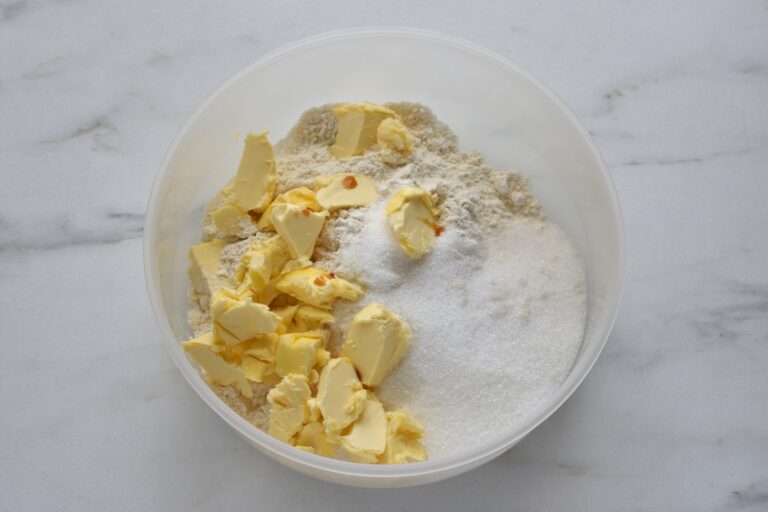 Flour, sugar, salt, butter and vanilla extract in a bowl.