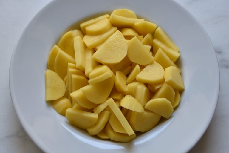 Sliced potatoes in a bowl.