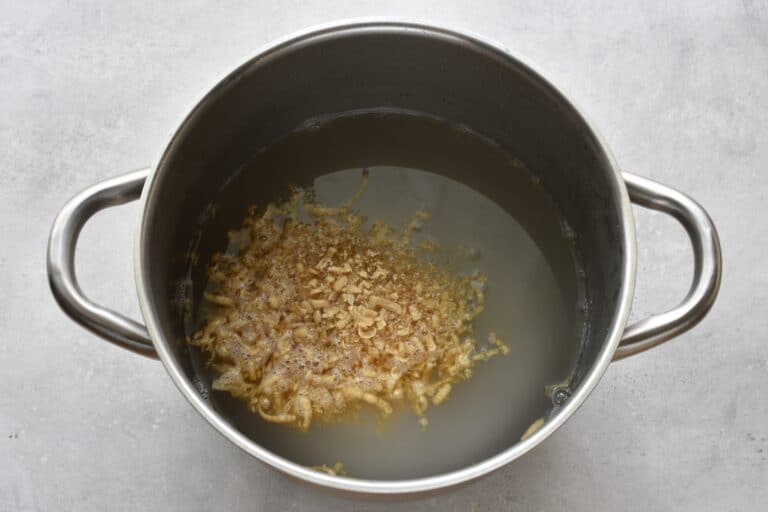 Grated Marseille soap, water, and bicarbonate of soda in a pan.