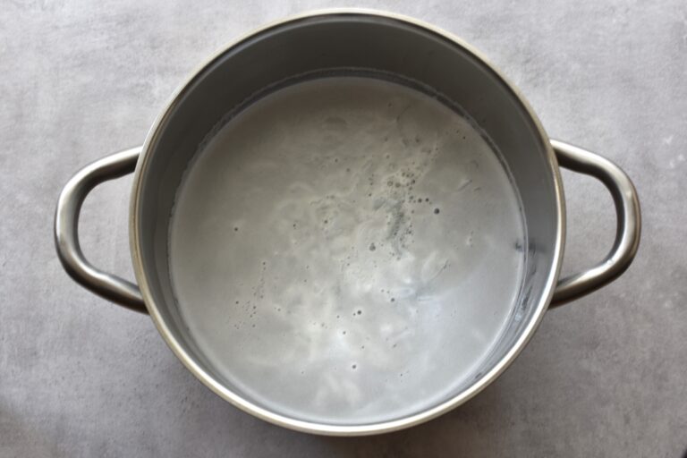 Soap, boiling water, and bicarbonate of soda in a pan.