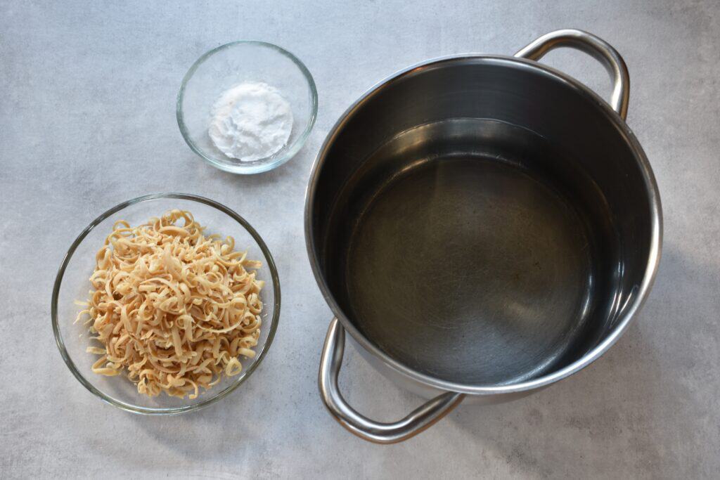 Ingredients for homemade vegan laundry soap (grated Marseille soap, bicarbonate of soda and water).