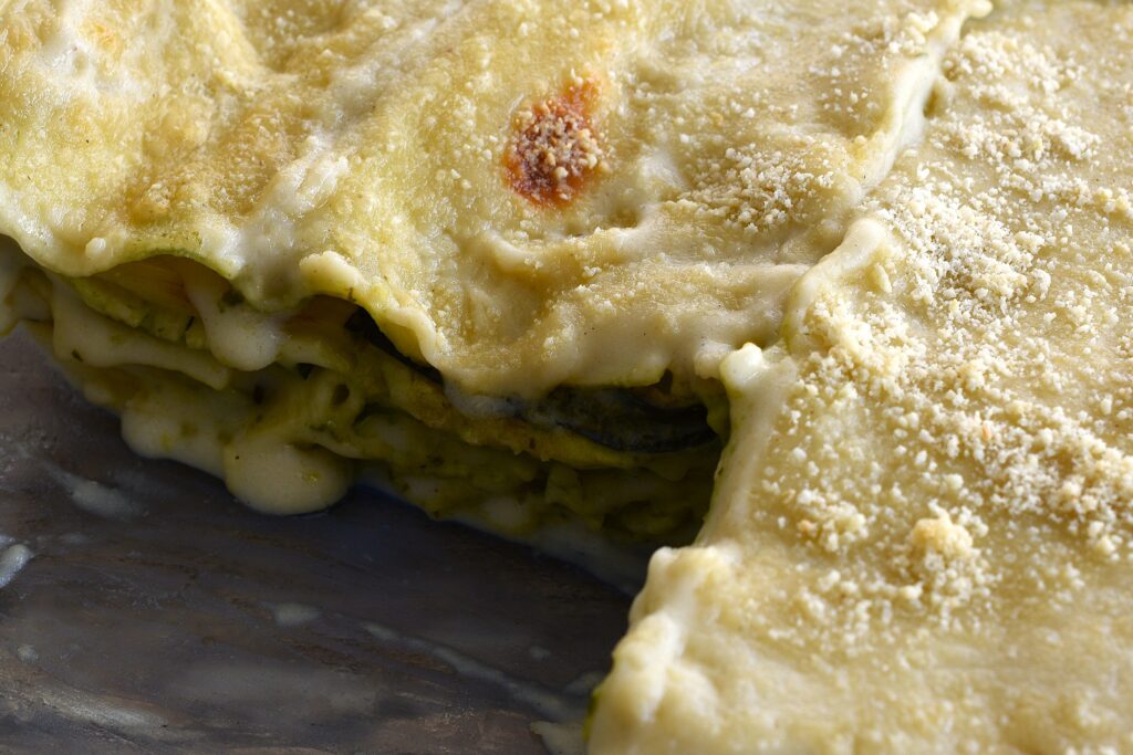 Vegan courgette (zucchini) and pesto lasagne in an oven dish.