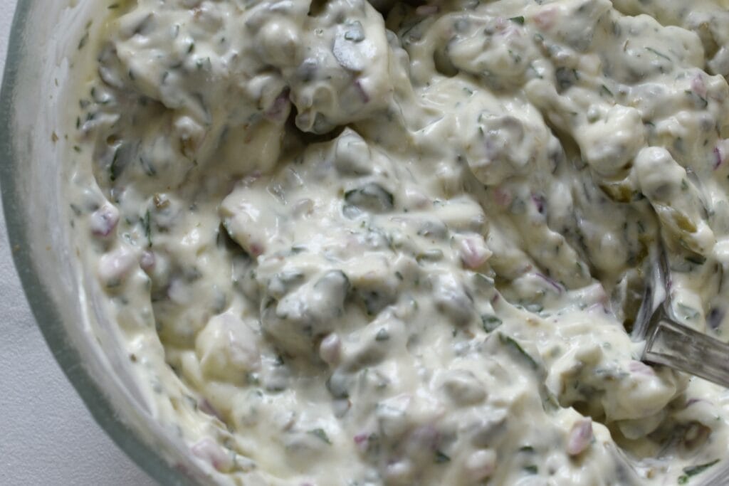 A close-up image of homemade vegan tartare sauce. 