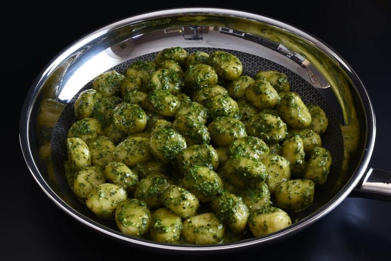 A pan pf homemade vegan potato gnocchi with vegan pesto genovese.