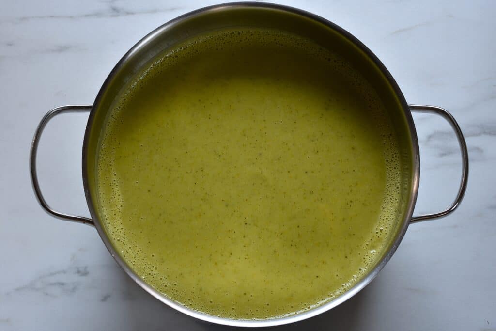 Vegan marrow soup in a saucepan on a worktop.