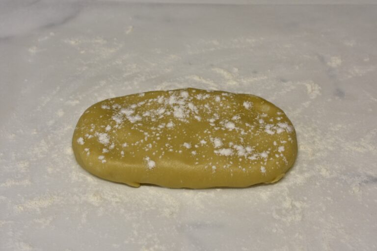 Pasta matta on a worktop with a sprinkling of flour.